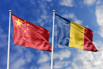 3d illustration. China and Romania Flag waving in sky. High detailed waving flag. 3D render. Waving in sky. Flags fluttered in the cloudy sky.