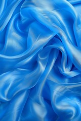 Fototapeta premium Tranquil blue silk waves flowing fabric abstract background with serene space for text placement