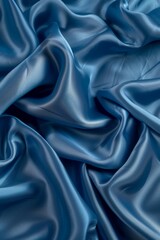 Obraz premium Tranquil blue silk waves flowing fabric abstract background with space for text