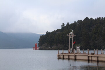Traditional shrine gate near lake in japan