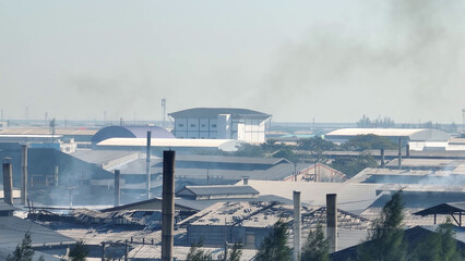 Aerial drones capture industrial estates emitting smoke, highlighting environmental concerns....