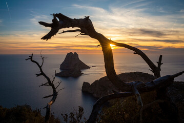 Beautiful sunset over Es Vedra island seen from the top of a cliff, Sant Josep de Sa Talaia, Ibiza, Balearic Islands, Spain