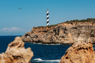 The picturesque Punta Moscarter lighthouse near Portinatx, Sant Joan de Labritja, Ibiza, Balearic Islands, Spain
