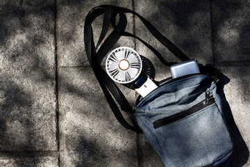 Portable rechargeable electric fan in a bag