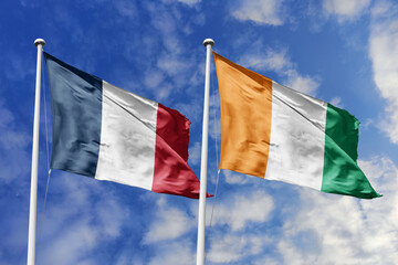 3d illustration. France and Ivory Coast Flag waving in sky. High detailed waving flag. 3D render....