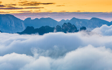 Sea of clouds at sunrise in the limestone karst mountains of Enshi Grand Canyon National Park,...