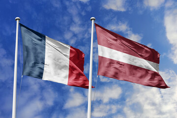 3d illustration. France and Latvia Flag waving in sky. High detailed waving flag. 3D render. Waving in sky. Flags fluttered in the cloudy sky.