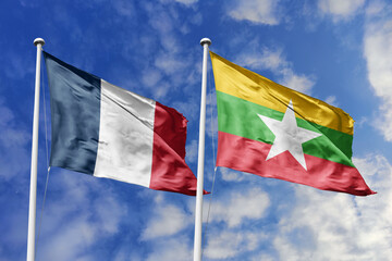 3d illustration. France and Myanmar Flag waving in sky. High detailed waving flag. 3D render. Waving in sky. Flags fluttered in the cloudy sky.