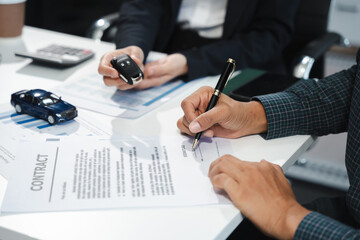 male signing car insurance document or lease. Writing signature on contract or agreement. Buying or selling new or guarantee.