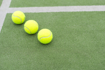 Tennis ball on green grass