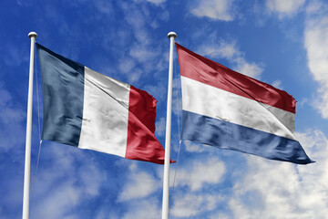 3d illustration. France and Netherlands Flag waving in sky. High detailed waving flag. 3D render. Waving in sky. Flags fluttered in the cloudy sky.