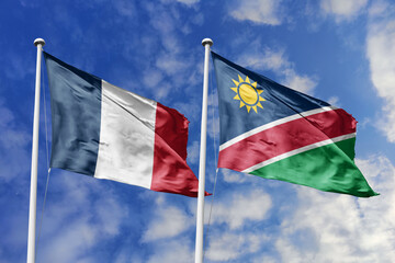 3d illustration. France and Namibia Flag waving in sky. High detailed waving flag. 3D render. Waving in sky. Flags fluttered in the cloudy sky.