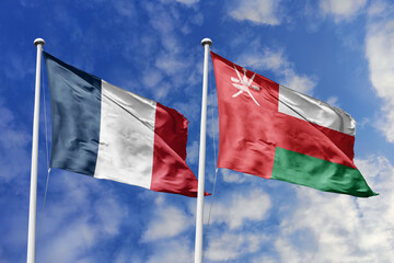 3d illustration. France and Oman Flag waving in sky. High detailed waving flag. 3D render. Waving in sky. Flags fluttered in the cloudy sky.