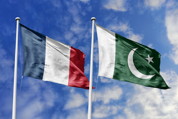 3d illustration. France and Pakistan Flag waving in sky. High detailed waving flag. 3D render. Waving in sky. Flags fluttered in the cloudy sky.