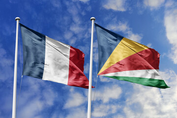 3d illustration. France and  Seychelles Flag waving in sky. High detailed waving flag. 3D render. Waving in sky. Flags fluttered in the cloudy sky.