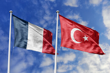 3d illustration. France and Turkey Flag waving in sky. High detailed waving flag. 3D render. Waving in sky. Flags fluttered in the cloudy sky.