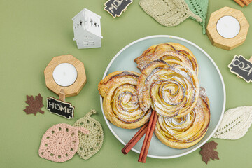 Apple roses pie with sugar powder. Traditional autumn baking, fall decor, flat lay