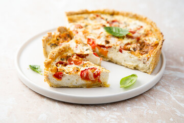 Homemade tomato quiche with basil
