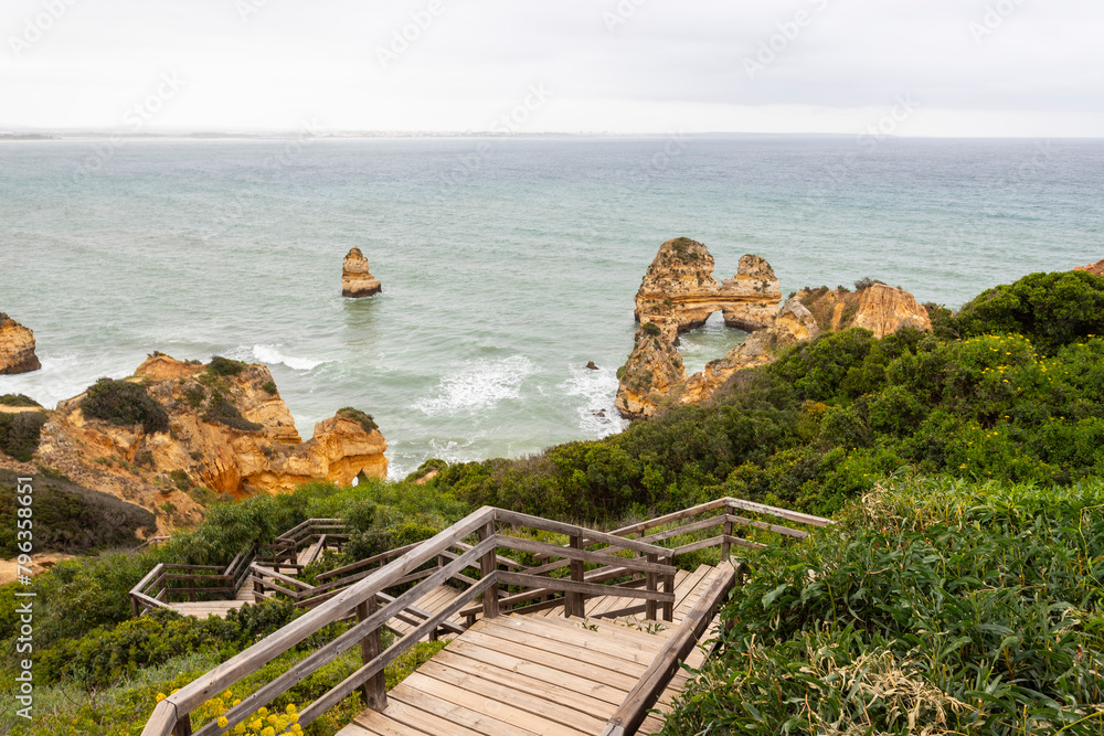 Poster cliffs of ponta da piedade during bad weather in algarve, portugal