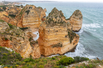 Cliffs of Ponta da Piedade during bad weather in Algarve, Portugal