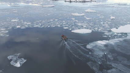 Zodiac Boat Sail Brash Ice Water Back Aerial View. Expedition Rubber Transport Explore Extreme...