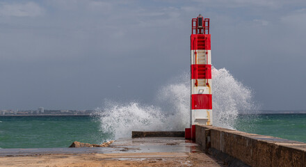 Lighthouses of Lagos get hits by waves in Algarve, Portugal