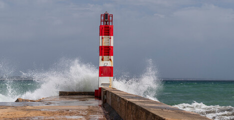Lighthouses of Lagos get hits by waves in Algarve, Portugal