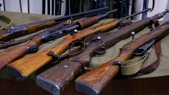 Many different vintage weapon guns close up