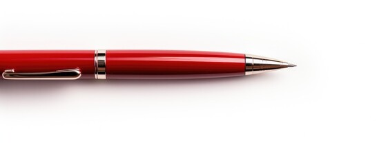 A red pen close-up with a silver tip