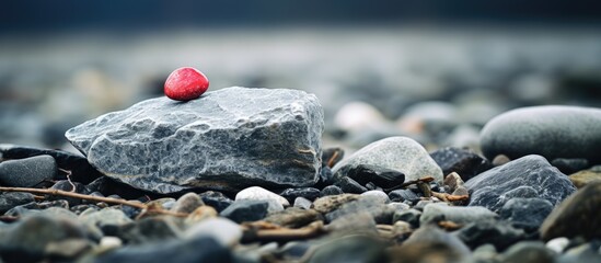 Heart on rock at rugged beach