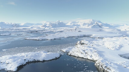 Arctic Polar Mountain Coast Aerial View. Snow Covered Antarctica Ocean Landscape Overview. North Nature Horizon Stunning Panorama Drone