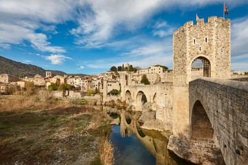 Medieval village of Besalu. Stone bridge. Garrotxa. Girona, Catalonia. Spain - obrazy, fototapety, plakaty