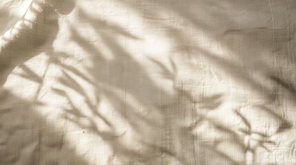 Floral sunlight shadows on a neutral beige cloth, aesthetic minimalist natural background with copy...