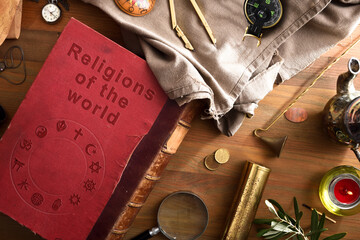 General view of book of world religions with ancient objects