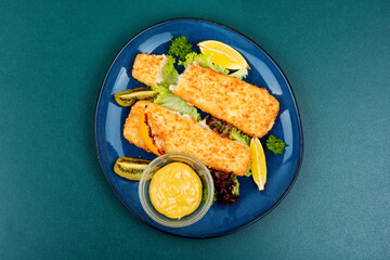 Fried pollock fillets with breadcrumbs