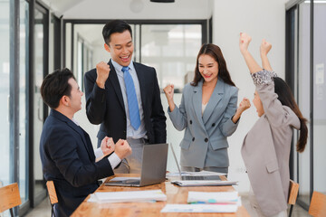 Team of young Asian entrepreneurs and startup have business meeting and encouraging each other for good spirit energy to accomplish successful marketing plan concept