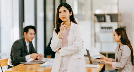 Business people meeting coworkers working together in boardroom, brainstorming, discussing and analyzing and planning business strategy