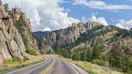 Fototapeta premium The highway s through a rugged mountain landscape with rocky cliffs and jagged peaks rising up on either side. . AI generation.