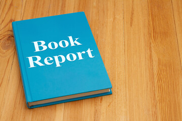 Book report for a course on retro old blue book on weathered desk
