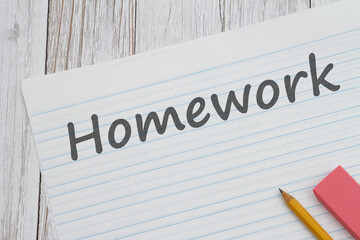 Homework message on ruled lined paper with pencil for school - obrazy, fototapety, plakaty