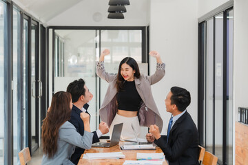 Young multiethnic diverse creative asian group huddle and high five hands together in office...