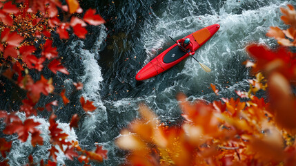 Red paddleboard navigating through gentle river rapids surrounded by autumn foliage