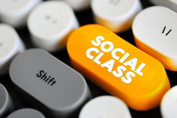 Social Class is a grouping of people into a set of hierarchical social categories, text concept button on keyboard - obrazy, fototapety, plakaty