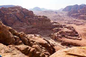 A view from above of the valley of the archeological site of Petra in Jordan with a view of the Nabatean Theatre