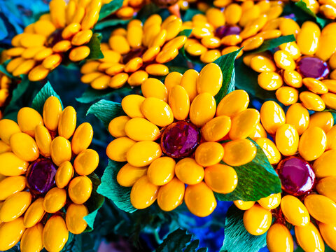 Stunning bunch of sunflowers made with typical Sulmona's confetti (sugar coated almonds), Abruzzo region, central Italy
