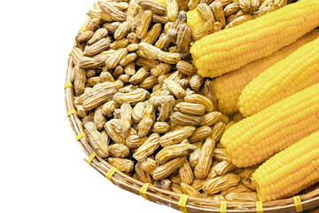 Isolated wicker basket with fresh corn cobs and raw peanuts, showcasing agricultural abundance and the diversity of farm produce, perfect for themes of organic farming and healthy eating