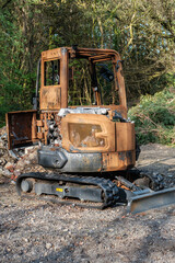 Burnt out excavator, construction vehicle on Hindhead Common
