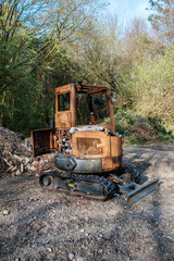 Burnt out excavator, construction vehicle on Hindhead Common