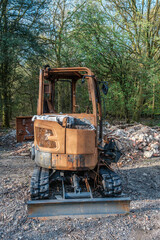Burnt out excavator, construction vehicle on Hindhead Common