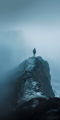 b'Man standing alone on top of a mountain' - obrazy, fototapety, plakaty